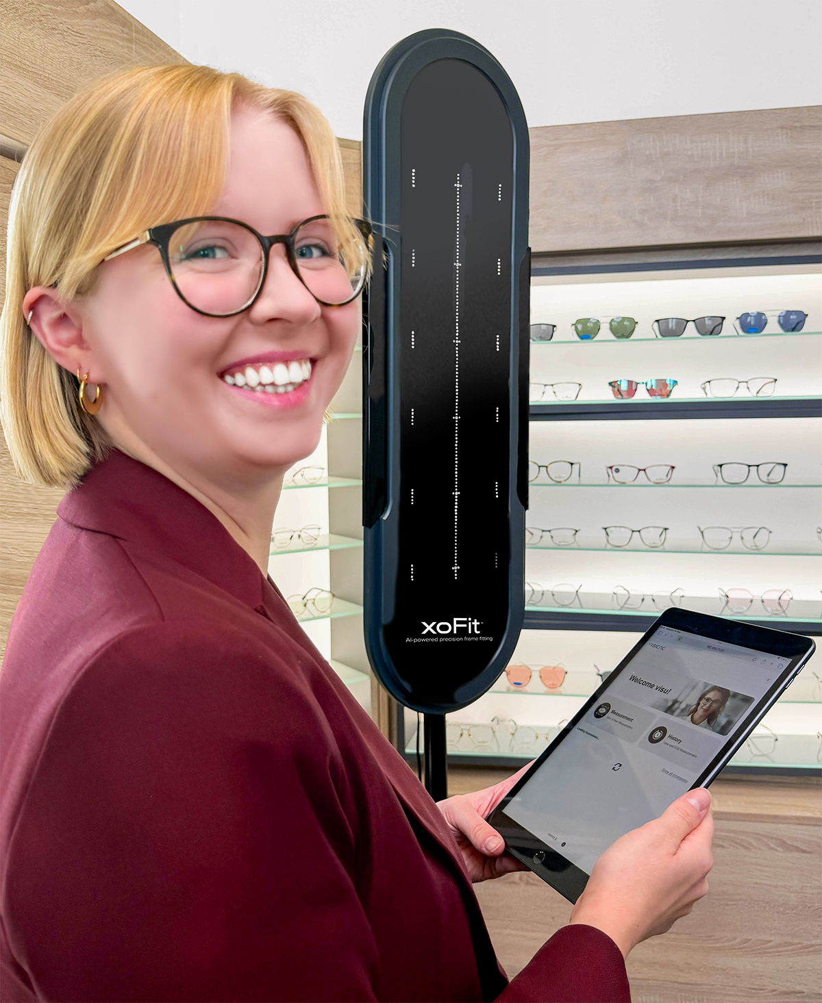 Woman controlling xoFit™ with tablet.